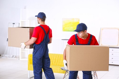Furniture pick-up service removing a sofa in Woodgreen