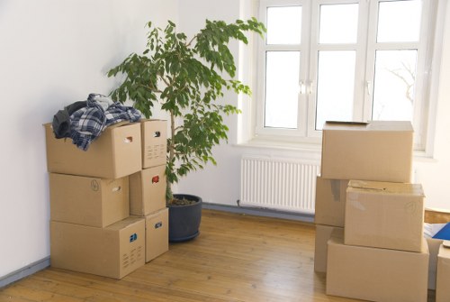 Packing boxes and furniture for a moving truck in Woodgreen