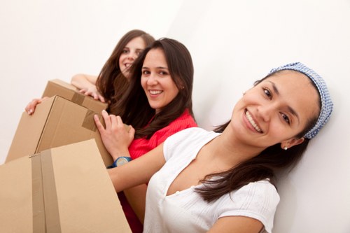 Local removal team loading furniture for an urgent move