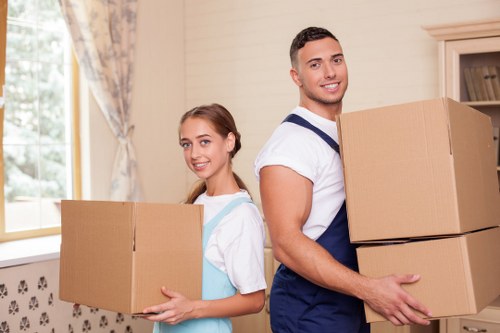 Packed boxes and stairway access for flat removals in Woodgreen