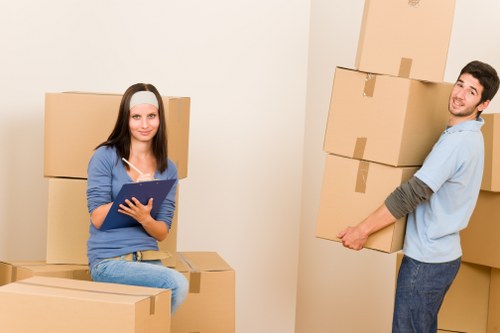 Professional movers loading items for a residential move in Wood Green